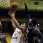 Southern Mississippi forward Daveon Boardingham, left, shoots past Rice forward Sean Obi during an NCAA college basketball game on Thursday, Jan. 16, 2014, in Hattiesburg, Miss. (AP Photo/Hattiesburg American, Ryan Moore) NO SALES **FILE**