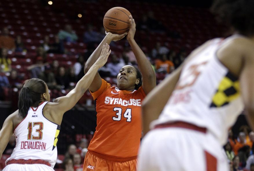 Syracuse center Shakeya Leary (34) shoots over Maryland center Alicia DeVaughn in the first half of an NCAA college basketball game in College Park, Md., Thursday, Jan. 16, 2014. (AP Photo/Patrick Semansky)