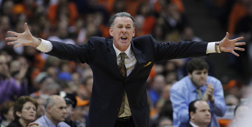 Pittsburgh’s head coach Jamie Dixon yells to his players in the second half of an NCAA college basketball game against Syracuse, Saturday, Jan. 18, 2014, in Syracuse, N.Y. Syracuse won 59-54. (AP Photo/Nick Lisi)