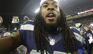 Seattle Seahawks&#39; Richard Sherman celebrates after the NFL football NFC Championship game against the San Francisco 49ers, Sunday, Jan. 19, 2014, in Seattle. The Seahawks won 23-17 to advance to Super Bowl XLVIII. (AP Photo/Elaine Thompson)