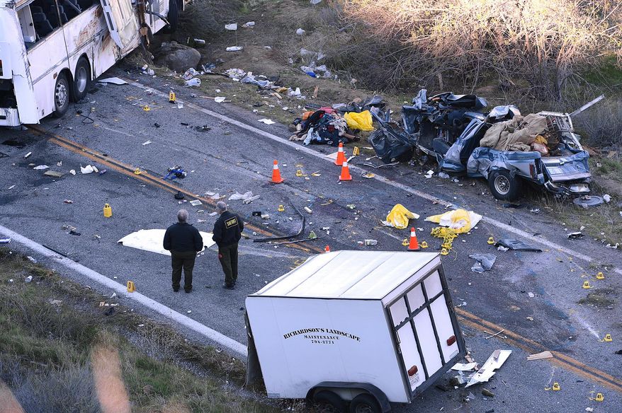 FILE - In this Feb. 4, 2013 photo, investigators work the scene where a tour bus collided with a pickup truck on Highway 38 north of Yucaipa, Calif., killing eight people. Federal regulators ordered the tour bus operator, National City, Calif.-based Scapadas Magicas LLC, to immediately stop operating because its buses weren't properly maintained or inspected and its drivers weren't properly vetted for qualifications. Intercity bus and truck companies with a continuing history of safety problems will be easier to shut down under new regulations the Federal Motor Carrier Administration said Friday that it plans to issue. The regulations give the agency authority to put out of business operators who have been cited for repeated problems, even if their most recent inspection alone doesn't quite meet the threshold for closure, the agency said. (AP Photo/The Sun, Rick Sforza, File)