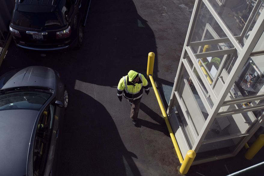 A crew member inspects a broken wheelchair lift in the loading area of the Cape May-Lewes Ferry in Lewes, Del. on Jan. 8, 2014. For a half-century, the ferry has beaten “driving around” virtually every day, stopping only for ice, hurricanes and an employee strike back in 1964. Going into its 50th year of operation, the ferry is up against declining ridership, but Heath Gehrke, director of ferry operations for the Delaware River and Bay Authority, hopes to bring back the excitement. (AP Photo/The Daily Times, Joe Lamberti) NO SALES