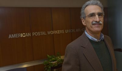 Mark Dimondstein, president of the American Postal Workers Union poses for a photo at their Washington headquarters, Friday, Jan. 17, 2014. The opening of Postal Service retail centers in dozens of Staples stores around the country is being met with threats of protests and boycotts by the agency’s unions. The new outlets are staffed by Staples employees, not postal workers, and labor officials say that move replaces good-paying union jobs with low-wage, nonunion workers. &amp;quot;It&#39;s a direct assault on our jobs and on public postal services,&amp;quot; said Mark Dimondstein, president of the 200,000-member American Postal Workers Union. (AP Photo/Pablo Martinez Monsivais)