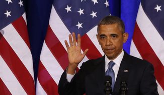 ** FILE ** In this Jan. 17, 2014, file photo, President Barack Obama waves to the audience after he spoke about National Security Agency (NSA) surveillance, at the Justice Department in Washington. (AP Photo/Charles Dharapak, File)