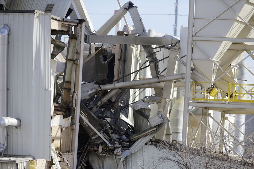 The International Nutrition plant is in wreckage in Omaha, Neb., where a fire and explosion took place Monday, Jan. 20, 2014. At least nine people have been hospitalized and others could be trapped at the animal feed processing plant. (AP Photo/Nati Harnik)