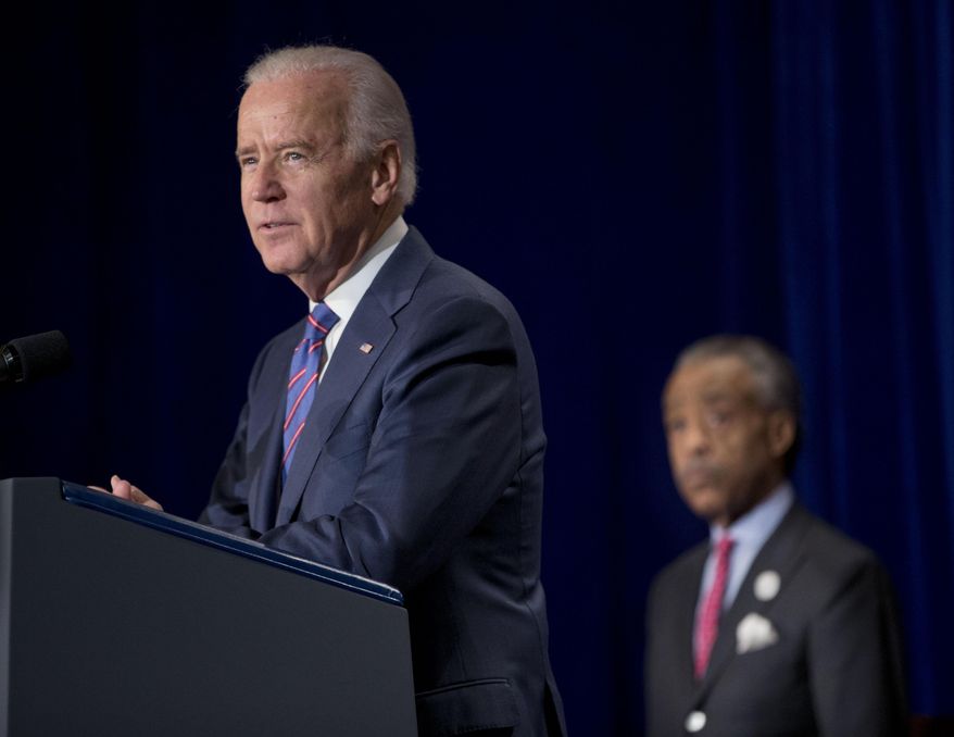 Vice President Joe Biden delivers the keynote address at the National Action Network's (NAN) Annual King Day breakfast convened by the Rev. Al Sharpton, right, in Washington, Monday, Jan. 20, 2014. (AP Photo/Pablo Martinez Monsivais)