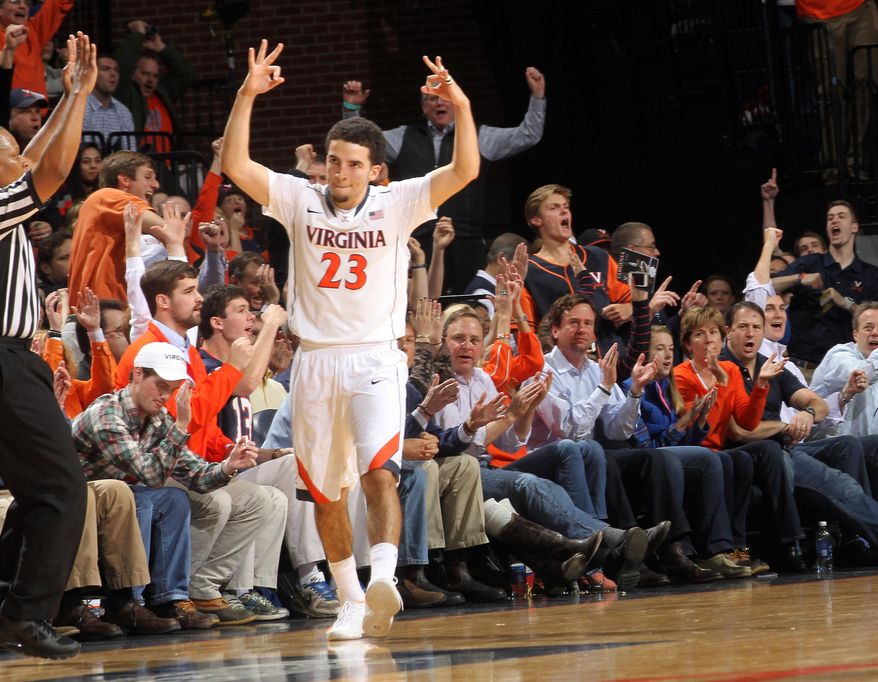 Virginia guard London Perrantes (23) celebrates a 3-point basket during the first half of an NCAA college basketball game against North Carolina, Monday, Jan. 20, 2014, in Charlottesville, Va. (AP Photo/Andrew Shurtleff)