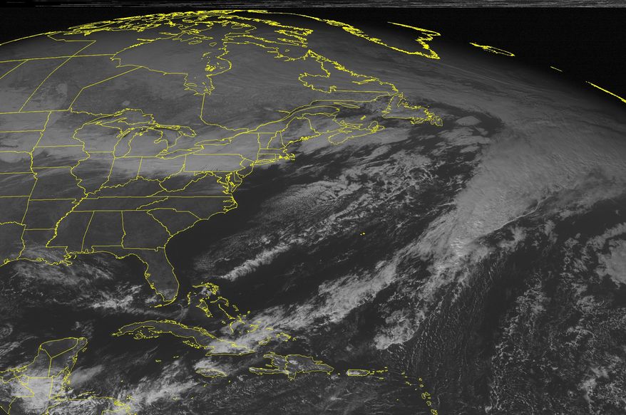 This NOAA satellite image taken Monday, Jan 20, 2014 at 01:45 PM EST shows cloudiness stretched from New England through the Mid Atlantic and Ohio Valley associated with a cold front moving eastward across the region. Snow, potentially heavy across the Appalachain mountains, will fall as this front moves eastward. Partly to mostly sunny skies continue across the southeastern United States.(AP Photo/Weather Underground)
