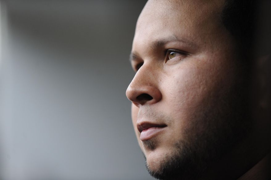 File-This Sept. 11, 2013, file photo shows suspended Detroit Tigers shortstop Jhonny Peralta looking on after working out with the team before an MLB baseball game against the Chicago White Sox in Chicago. Matt Holliday has been an outspoken critic of players who have used performance-enhancing drugs. When it comes to Peralta, his new St. Louis Cardinals teammate, he is willing to forgive and forget. (AP Photo/Paul Beaty, File)