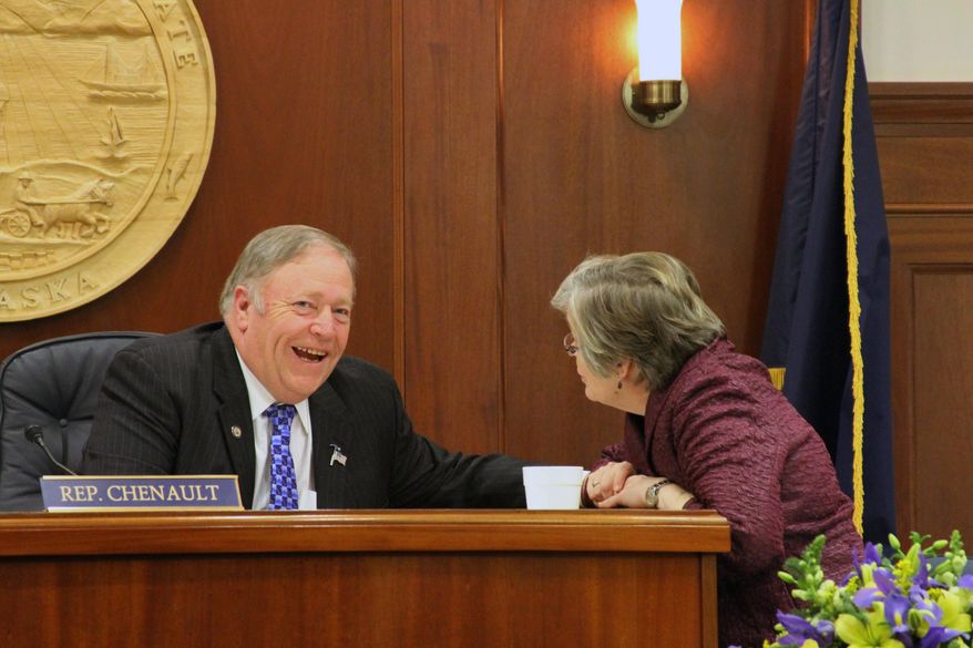 House Speaker Mike Chenault, R-Nikiski, left, talks with a staff member during a recess on Tuesday, Jan. 21, 2014, during the first day of the Alaska House of Representatives's session in Juneau, Alaska. (AP Photo/Mark Thiessen)