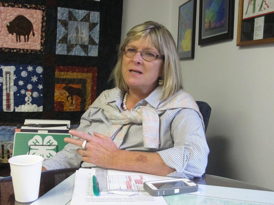 Rep. Beth Kerttula, D-Juneau, speaks to a reporter on Tuesday, Jan. 21, 2014, in Juneau, Alaska, about her decision to resign from the Alaska Legislature to serve as a visiting fellow with the Center for Ocean Solutions at Stanford University. Kerttula stepped down as minority leader on Tuesday, which was the first day of the new session, and said she would be resigning from the Legislature on Friday. (AP Photo/Becky Bohrer)