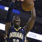 Indiana Pacers&#39; Ian Mahinmi scores against the Golden State Warriors during the first half of an NBA basketball game, Monday, Jan. 20, 2014, in Oakland, Calif. (AP Photo/Ben Margot)