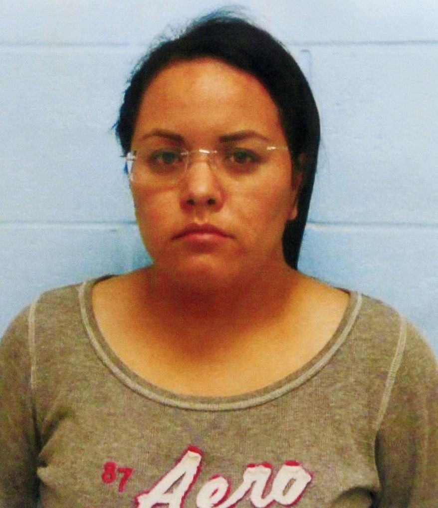 ADDS RECENT DEVELOPMENT -This photo provided by the McAllen, Texas police shows Mary Carmen Garcia, 27, of Monterrey, Mexico. Garcia and Daniel Guardiola Dominguez, 28, also of Monterrey, were arrested Sunday, Jan. 19, 2014, after arriving at the border with 96 fraudulent credit cards produced using data stolen during the Target security breach late last year. A South Texas police chief said Monday Jan. 20, 2014, that two Mexican citizens who were arrested at the border used account information stolen during the Target security breach to buy tens of thousands of dollars' worth of merchandise. But a federal official said later there currently was no connection between the arrests and the retailer's credit card data theft. (AP Photo/McAllen Police via The Monitor) MAGS OUT; TV OUT