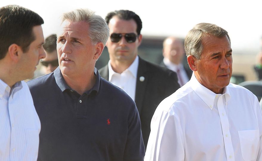 Republican Reps. Devin Nunes, left,and Rep. Kevin McCarthy, center, and House Speaker John Boehner, right, prepare for a news conference about the drought situation in the Central Valley, Wednesday, Jan. 22, 2014, near Bakersfield, Calif. Boehner visited a dusty California field, joining Central Valley Republicans to announce an emergency drought-relief bill to help farmers through what is certain to be a devastating year. If passed, the bill that's already stirring controversy would temporarily halt restoration of the San Joaquin River designed to bring back the historic salmon flow, among other measures. Farmers want that water diverted to their crops. (AP photo/The Bakersfield Californian, Casey Christie) MAGS OUT ONLINES OUT TV OUT NO SALES