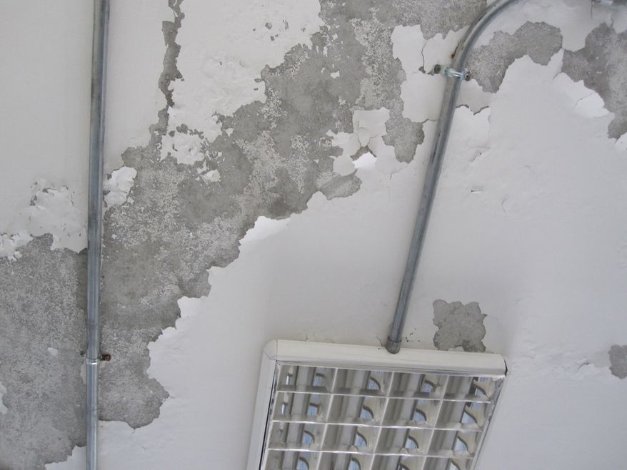 Paint peeling off classroom ceiling of the Balkh Education Facility in Afghanistan.
In the latest aid problem in Afghanistan, investigators found that a school built for the Balkh province is still unfinished, with structural issues that could pose a danger to students and teachers.
“Nearly 5 years after construction began, the U.S. Agency for International Development (USAID) is unable to transfer the facility to Afghan authorities,†said the Special Inspector General for Afghanistan Reconstruction.
The school needs repairs to “a leaking roof, defective electrical wiring, and an improperly sloped terrace roof,†inspectors said, adding that sewer pipes near water sources aren't properly insulated, raising the possibility of contamination.
They're also concerned about whether the roof and septic system are designed to hold the weight imposed on them, and that officials cannot assure that the structure “will not collapse at some point in time.â€
USAID disagreed that the building is structurally unsound. The Army Corps of Engineers which built the school, has “rigorous procedures and requirements for the design and construction of its building projects.â€
The aid agency did agree that work on the school is incomplete, and said they will fix any remaining problems with the building.
The school has yet to be approved for use, but classes were held in the building in 2013. In response, USAID secured the facility to make sure no one used it, but SIGAR noted that Afghan authorities are not pleased about the ongoing delays.
The original contract to build the school was just under $3 million, part of a $17.1 million program to build a system of educational facilities across Afghanistan.