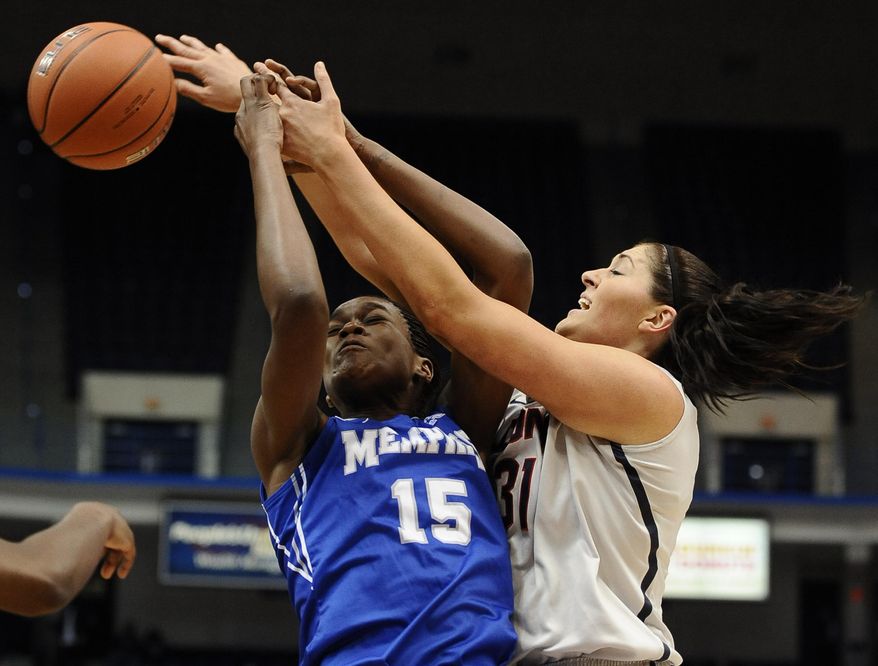 Memphis' Pa'Sonna Hope, left, and Connecticut's Stefanie Dolson, right, vie for a rebound during the first half of an NCAA college basketball game, Wednesday, Jan. 22, 2014, in Hartford, Conn. (AP Photo/Jessica Hill)