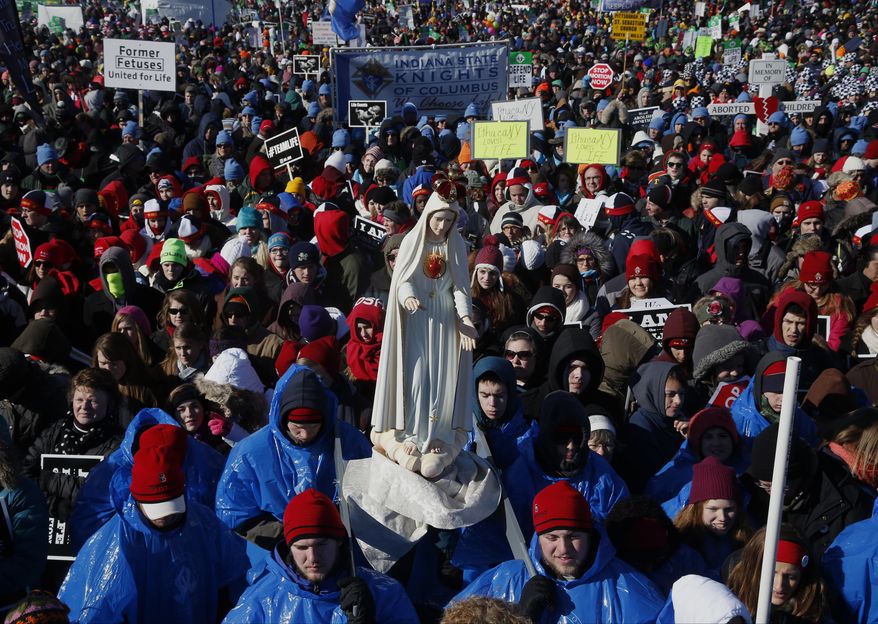 Anti-abortion demonstrators rally during the annual March for Life on the National Mall in Washington, Wednesday, Jan. 22, 2014. Thousands of anti-abortion demonstrators are gathering in Washington for an annual march to protest the Supreme Court's landmark 1973 decision that declared a constitutional right to abortion. (AP Photo/Charles Dharapak)