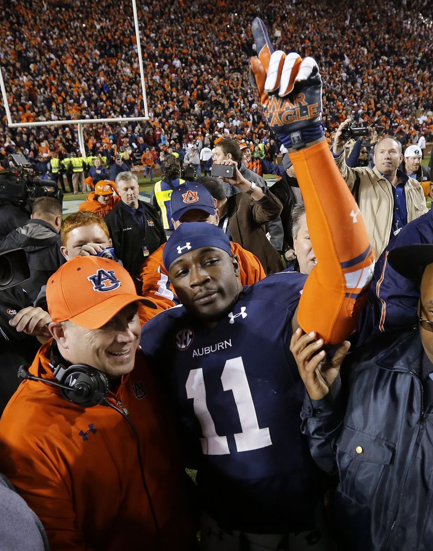 FILE - In this Nov. 30, 2013, file photo, Auburn cornerback Chris Davis (11) reacts after returning a missed field goal attempt 109 yards to score the game-winning touchdown as time expired an NCAA college football game against Alabama in Auburn, Ala. Davis and Dee Ford were much like their Auburn team early in the season, largely floating under the radar. The two defensive players garnered much more attention as the Tigers had success and are trying to forge NFL careers starting with the Senior Bowl. (AP Photo/Dave Martin, File)