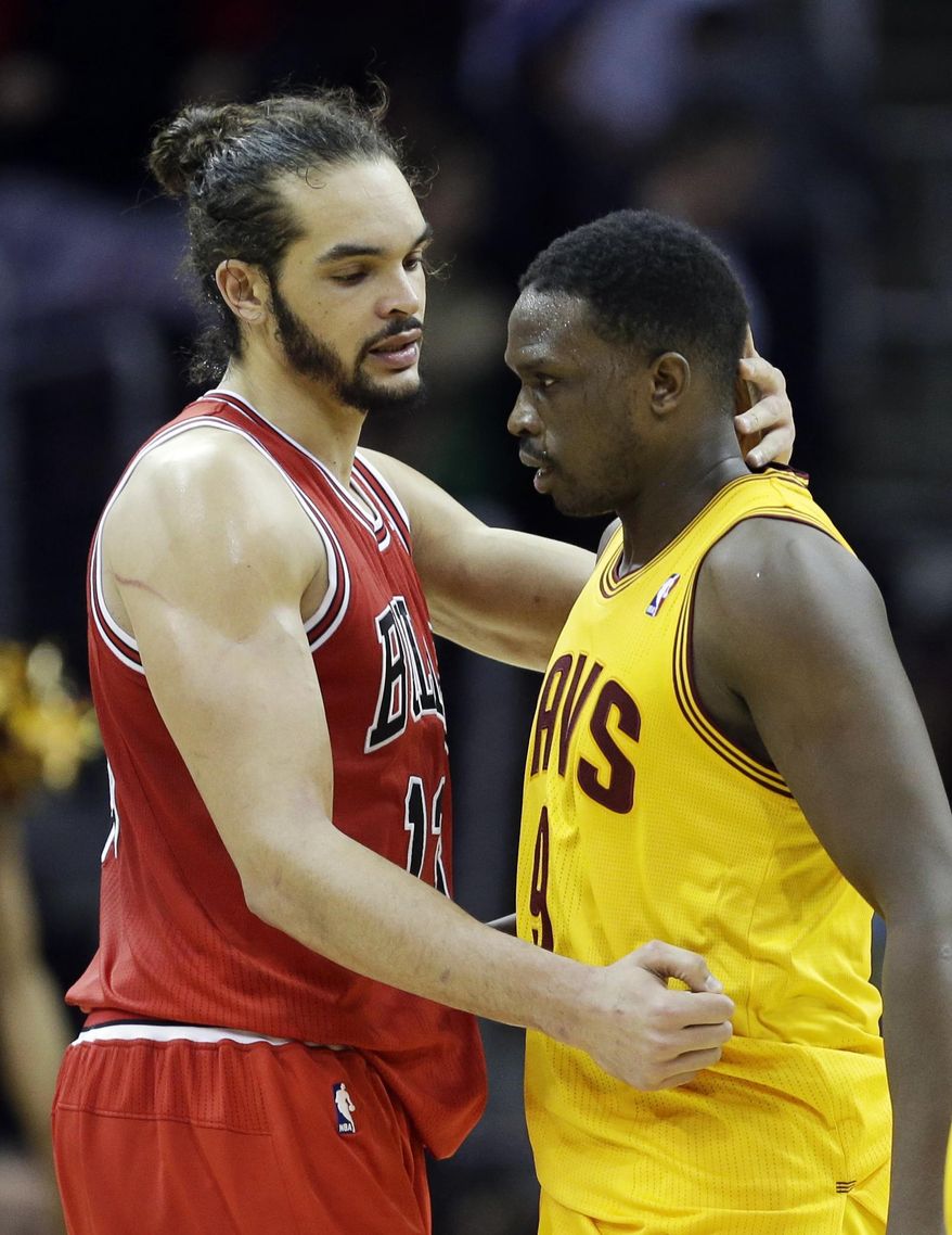 Chicago Bulls' Joakim Noah, left, embraces Cleveland Cavaliers' Luol Deng, of Sudan, after the Bulls' 98-87 win in an NBA basketball game Wednesday, Jan. 22, 2014, in Cleveland. Deng was traded from Chicago to Cleveland in early January. (AP Photo/Mark Duncan)