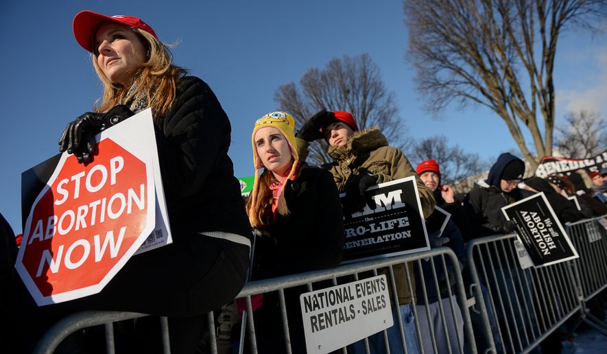 State Rep. Lenar Whitney of Louisiana, left, joins thousands of anti-abortion demonstrators at a rally at the annual March for Life on the National Mall, Washington, D.C., Wednesday, January 22, 2014. (Andrew Harnik/The Washington Times)