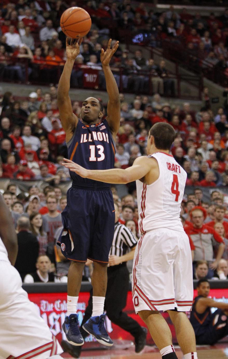 Illinois Tracy Abrams, left, goes up for a shot against Ohio State's Aaron Craft during the first half of an NCAA college basketball game in Columbus, Ohio, Thursday, Jan. 23, 2014. ( AP Photo/Paul Vernon)