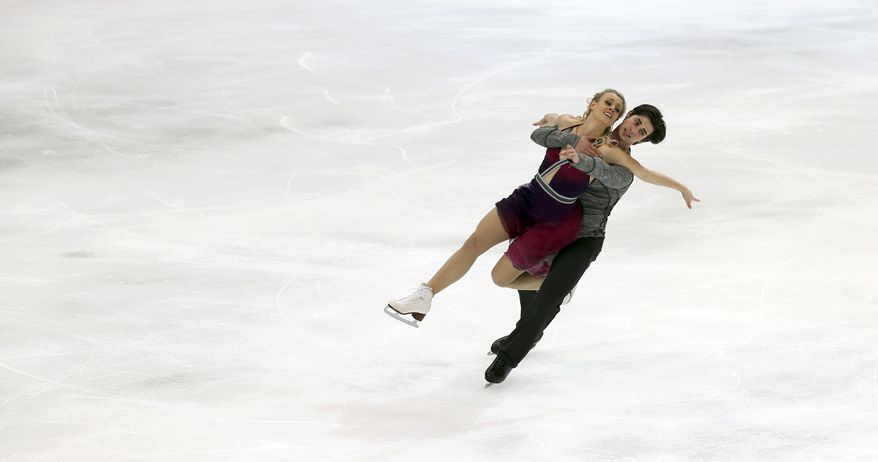 United States&#x27; Madison Hubbell and Zachary Donohue perform during the ice dance free dance at the Four Continents figure skating championships in Taipei, Taiwan, Thursday, Jan. 23, 2014. (AP Photo/Chiang Ying-ying)