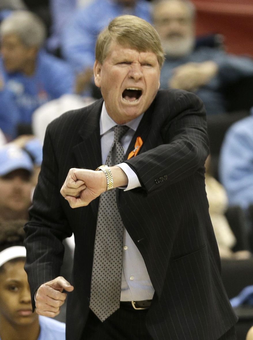 North Carolina associate head coach Andrew Calder argues a call during the first half of an NCAA college basketball game against Wake Forest in Winston-Salem, N.C., Thursday, Jan. 23, 2014. (AP Photo/Chuck Burton)
