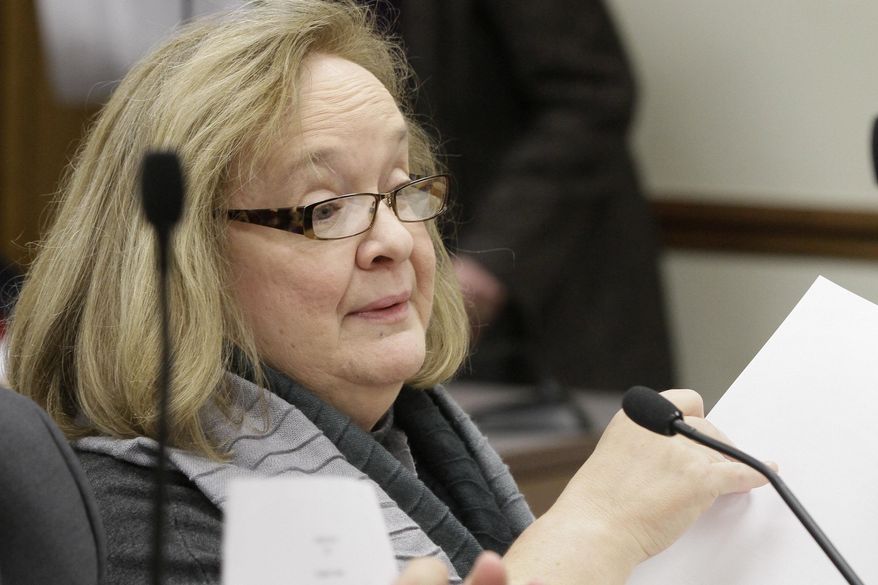 Martha Adcock, general counsel for the Arkansas Secretary of State's office, testifies at a joint meeting of the House and Senate Committees on State Agencies and Governmental Affairs at the Arkansas state Capitol in Little Rock, Ark., Thursday, Jan. 23, 2014. The Secretary of State's office cleared the way for three constitutional amendments to appear in November election ballots. (AP Photo/Danny Johnston)