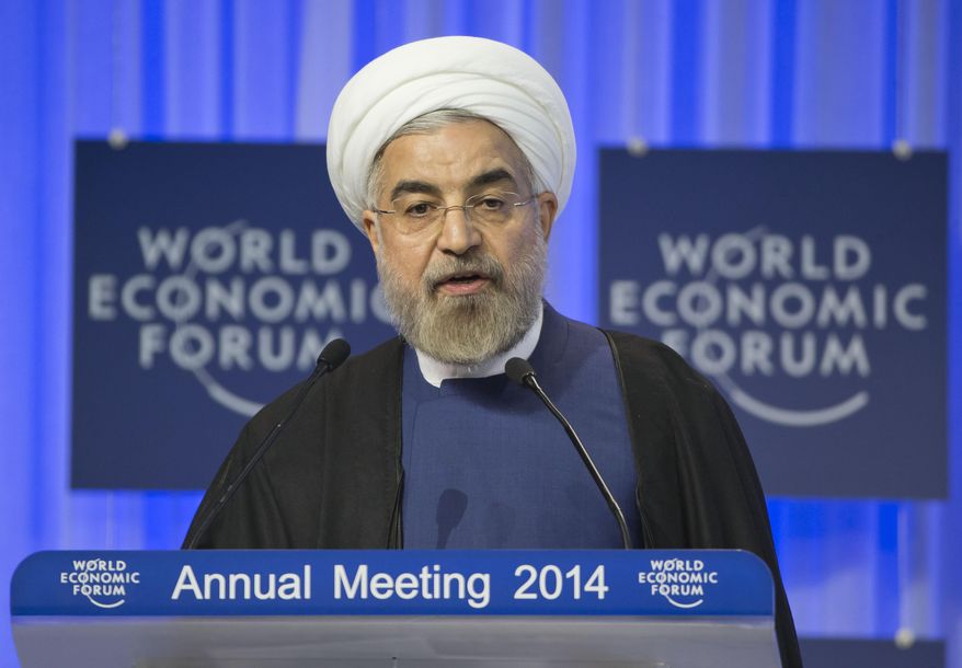 Iranian President Hassan Rouhani, speaks during a session of the World Economic Forum in Davos, Switzerland, Thursday, Jan. 23, 2014. Leaders gathered in the Swiss ski resort of Davos have made it a top priority to push to reshape the global economy and cut global warming by shifting to cleaner energy sources. (AP Photo/Michel Euler)