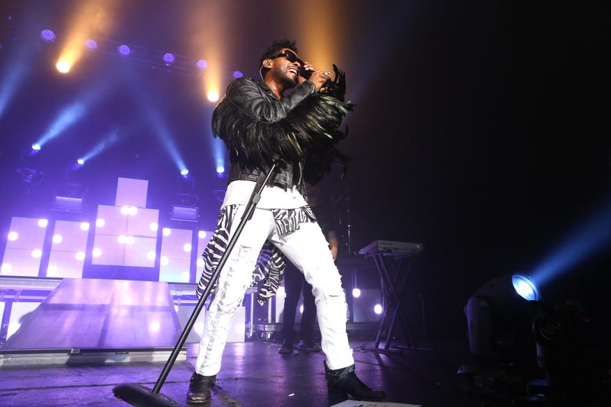 This Jan. 22, 2014 photo shows Miguel performing in Los Angeles. (Photo by Alexandra Wyman/Invision/AP)