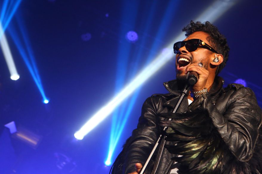 This Jan. 22, 2014 photo shows Miguel performing in Los Angeles. (Photo by Alexandra Wyman/Invision/AP)