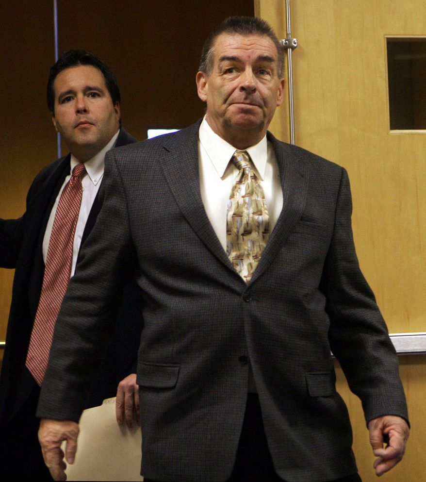 **FILE** Former state corrections sergeant Douglas Tower (right) and his lawyer Richard Monteith arrive in District Court in Concord, N.H., on Jan. 30, 2006, where he waived his right to a probable cause hearing. Tower is charged with raping four female inmates under his supervision at a halfway house. (Associated Press)