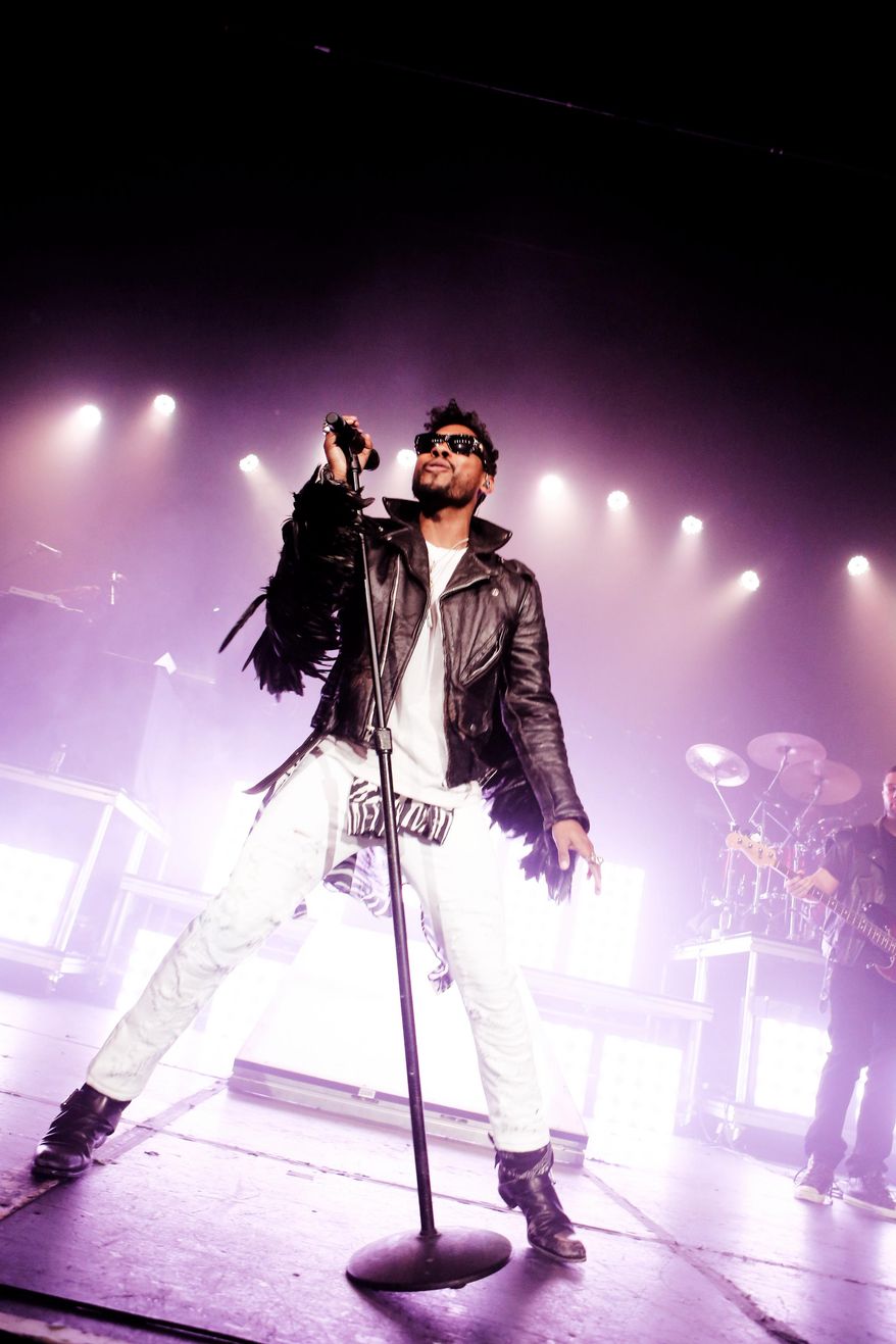 This Jan. 22, 2014 photo shows Miguel performing in Los Angeles. (Photo by Alexandra Wyman/Invision/AP)