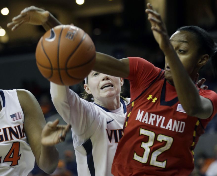 Virginia guard Lexie Gerson, left, reaches for a rebound behind Maryland guard Shatori Walker-Kimbrough (32) during the first half of an NCAA woman's college basketball game in Charlottesville, Va., Thursday, Jan. 23, 2014. (AP Photo/Steve Helber)