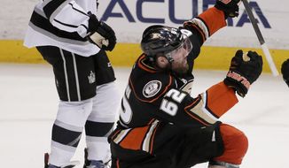 Anaheim Ducks left wing Patrick Maroon, right, celebrates his goal as Los Angeles Kings center Colin Fraser looks on during the second period of an NHL hockey game in Anaheim, Calif., Thursday, Jan. 23, 2014. (AP Photo/Chris Carlson)
