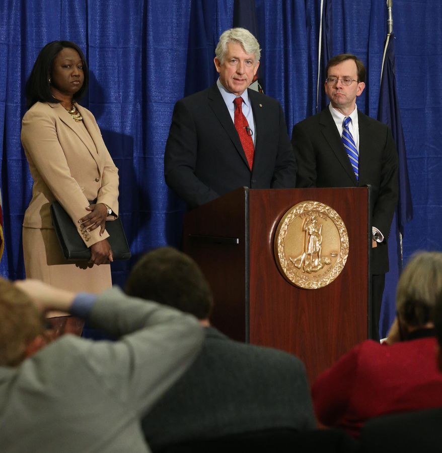 Virginia Attorney General Mark Herring, center, is joined by Chief Deputy Attorney General Cynthia Hudson, left, and Solicitor General Stuart Raphael at a press conference at his office in Richmond, Va., Thursday, Jan. 23, 2014. Herring stated he has changed his position on the marriage equality case and now supports gay marriage. (AP Photo/Richmond Times-Dispatch, Bob Brown).