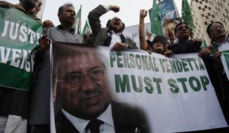 In this Thursday, Jan. 23, 2014 photo, supporters of Pakistan&#39;s former president and military ruler Pervez Musharraf rally in Karachi, Pakistan. A prosecutor and defense lawyer say Pakistan’s former military ruler Pervez Musharraf who is facing a high treason case wants to be treated abroad for a heart disease. (AP Photo/Shakil Adil)