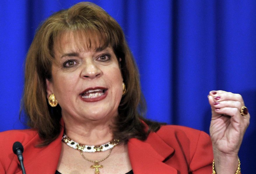 FILE - In this April 11, 2012, file photo, Florida State Attorney Angela Corey announces in Jacksonville, Fla., that George Zimmerman will be charged with second-degree murder in the shooting death of Trayvon Martin. Zimmerman made a painting that The Associated Press says directly copies this photo. Zimmerman's brother, Robert Zimmerman Jr., posted an image of the painting on Twitter on Wednesday, Jan. 23, 2014, and has said that he and his brother are in private negotiations with possible buyers. The AP has demanded that they halt the sale of the painting. (AP Photo/Rick Wilson, File)