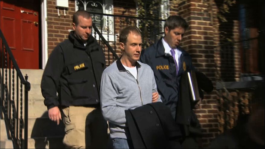 ** FILE ** This Dec. 11, 2013, image from video provided by WJLA-TV, shows Ryan Loskarn, former chief of staff to Sen. Lamar Alexander, R-Tenn., being escorted from his Washington home by U.S. Postal Inspector police. Loskarn has been found dead in Maryland, just weeks after the former staffer's arrest on child pornography charges. (AP Photo/WJLA-TV)