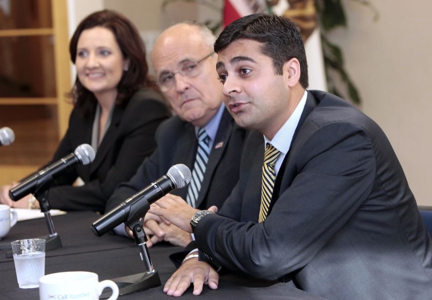 FILE -- In this Sept. 20,  2012 file photo, Ricky Gill, the Republican candidate for the 9th Congressional District, right, responds to a question during a news conference with former New York City Mayor Rudy Giuliani, and Kim Vann, the GOP candidate for the 3rd Congressional District, in Sacramento, Calif.  Gill, who eventually lost a tight Congressional race to incumbent, Democrat Rep. Jerry McNerney, is among a growing roster of candidates and elected officials of Indian descent.(AP Photo/Rich Pedroncelli, file)