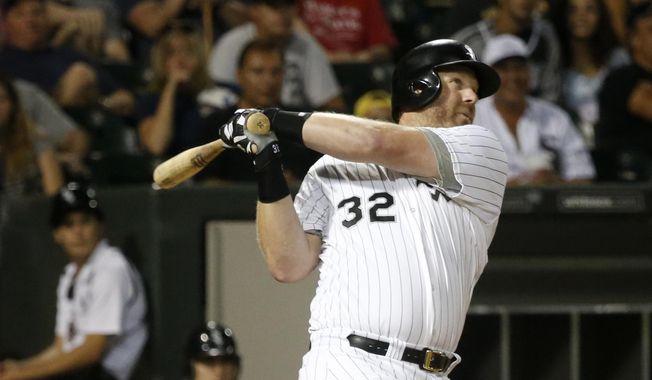 FILE - In this Aug. 25, 2013 file photo, Chicago White Sox's Adam Dunn watches his two-run home run off Houston Astros starting pitcher Brett Oberholtzer during the sixth inning of a baseball game in Chicago. Dunn has a small role as a bartender in the film "Dallas Buyers Club". White Sox manager Robin Ventura said it was surprising to see Dunn on the screen, Saturday, Jan. 25, 2014. (AP Photo/Charles Rex Arbogast, File)