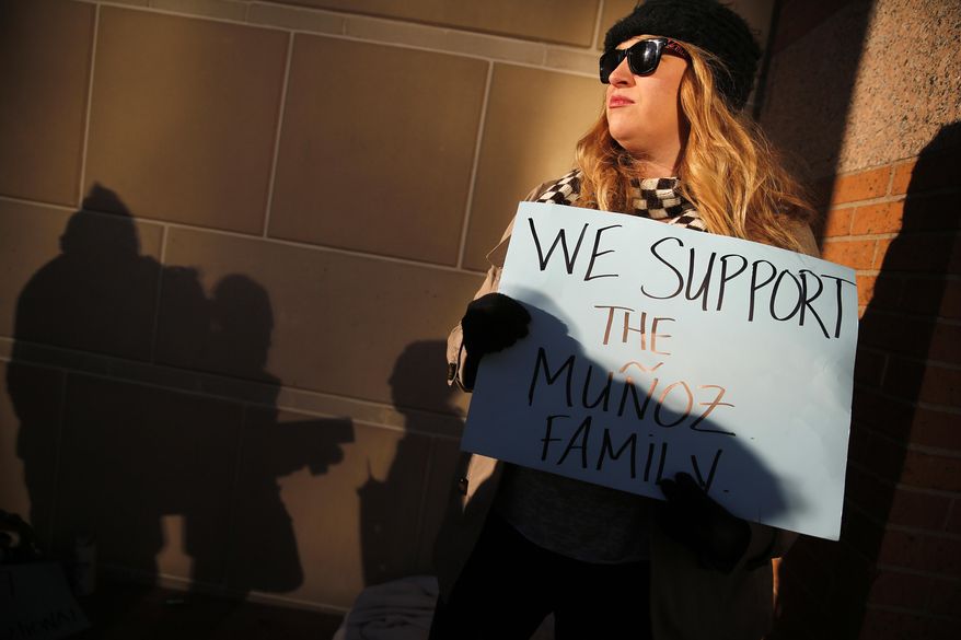 Autumn Brackeen of Fort Worth, Texas shows her support for the Munoz family outside the Tim Curry Criminal Justice Center, in Fort Worth, Texas on Friday, Jan. 24, 2014, after a judge ruled in Marlise Munoz life or death case. Erick Munoz's wife Marlise is brain dead and on life support with his unborn child at John Peter Smith Hospital. The judge has sided with the family of Marlise Munoz and ordered John Peter Smith Hospital to declare the pregnant woman dead and withdraw life support by 5 p.m. Monday. (AP Photo/The Dallas Morning News, Tom Fox)