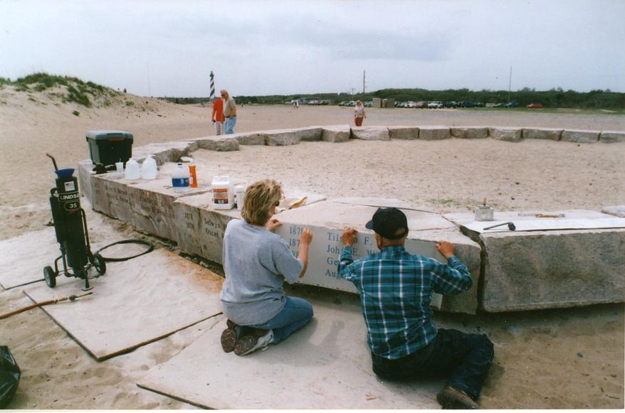 In a 2001 photo provided by Bruce Roberts,the stones being engraved with the names of the 83 light keepers by A.C. Joyner and his daughter, Rebecca. When the Cape Hatteras Lighthouse was moved 15 years ago, the stones were left behind at the erosion-prone spot on the Atlantic. Hatteras Island residents want the stones moved to the lighthouse so that they are publicly visible year-round and better protected from erosion. But the decision rests with the National Park Service, and so far there is no indication that the stones will be moved. (AP Photo/Bruce Roberts)