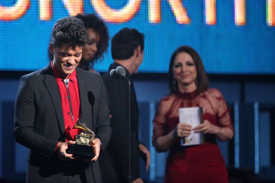 Bruno Mars accepts the award for best pop vocal album for "Unorthodox Jukebox" at the 56th annual Grammy Awards at Staples Center on Sunday, Jan. 26, 2014, in Los Angeles. (Photo by Matt Sayles/Invision/AP)