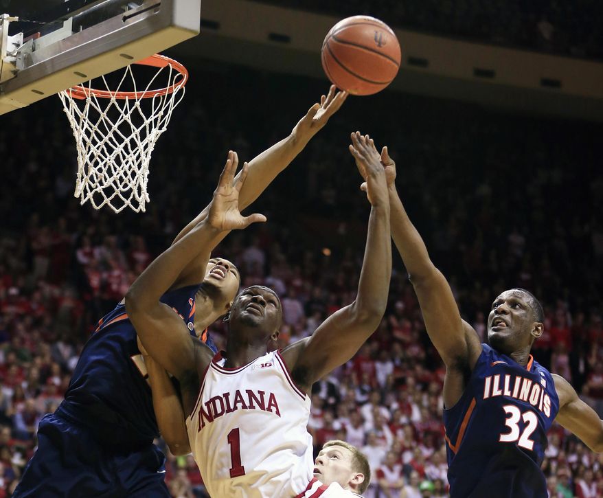 Indiana's Noah Vonleh (1) battles of a rebound against Illinois' Malcolm Hill (21) and Nnanna Egwu (32) during the first half of an NCAA college basketball game, Sunday, Jan. 26, 2014, in Bloomington, Ind. (AP Photo/Darron Cummings)