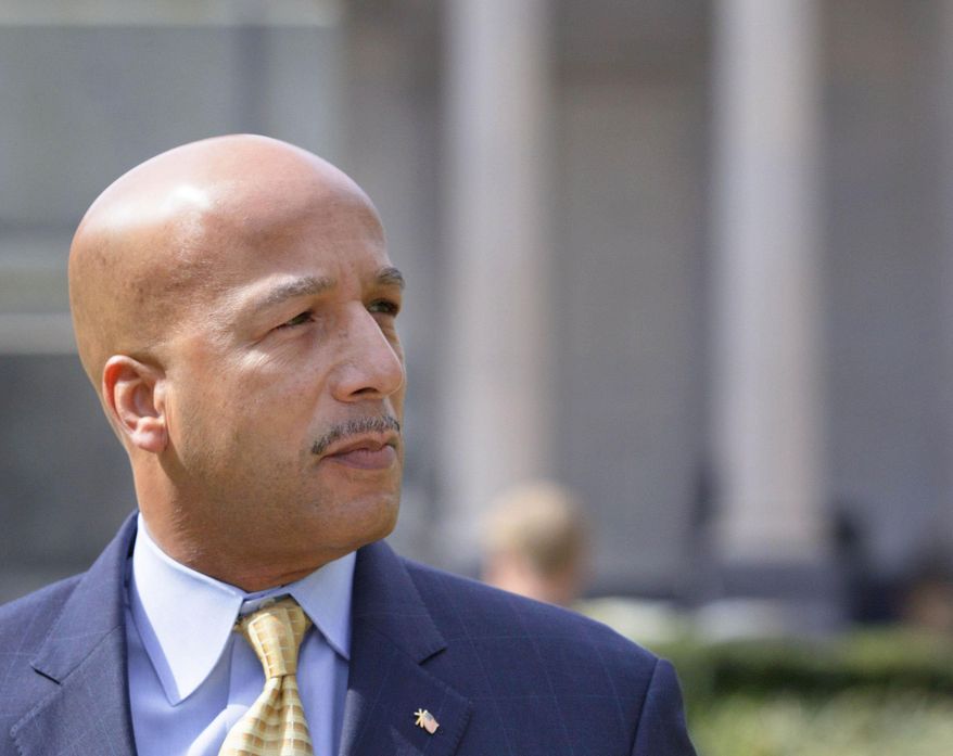 FILE - In a Wednesday, Feb. 20, 2013 file photo, former New Orleans Mayor C. Ray Nagin walks past Gallier Hall, the old New Orleans City Hall as he arrives at the Hale Boggs Federal Building and United States District Courthouse to appear in federal court for an arraignment on public corruption charges in New Orleans. Nagin, who led the city during its darkest days after Hurricane Katrina, will be thrust back into the spotlight Monday, Jan. 27, 2013 when he goes on trial in a corruption case that mushroomed at the end of his eight-year tenure. (AP Photo/Matthew Hinton, File)
