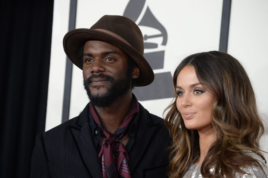 Gary Clark Jr., left, and Nicole Trunfio arrive at the 56th annual GRAMMY Awards at Staples Center on Sunday, Jan. 26, 2014, in Los Angeles. (Photo by Jordan Strauss/Invision/AP)
