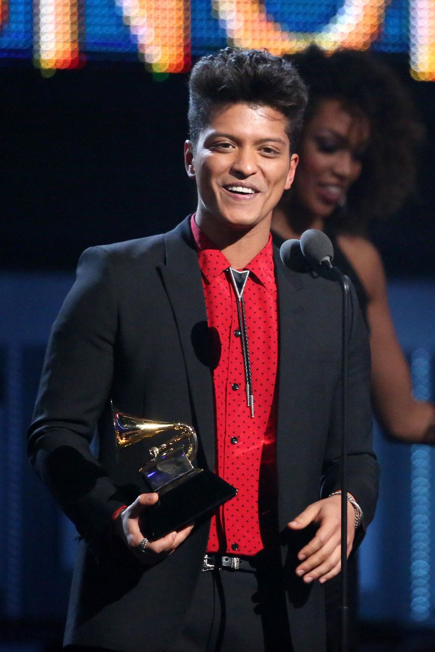 Bruno Mars accepts the award for best pop vocal album for "Unorthodox Jukebox" at the 56th annual Grammy Awards at Staples Center on Sunday, Jan. 26, 2014, in Los Angeles. (Photo by Matt Sayles/Invision/AP)