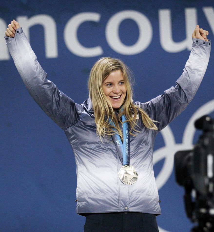 FILE - In this Feb. 19, 2010 file photo, Hannah Teter, of the United States, celebrates with her silver medal in the women's snowboard halfpipe at the Vancouver 2010 Olympics in Vancouver, British Columbia. Teter is among Vermont’s lineup of at least 11 athletes who will compete in the 2014 Winter Olympics in Sochi, Russia. (AP Photo/Marcio Sanchez, File)