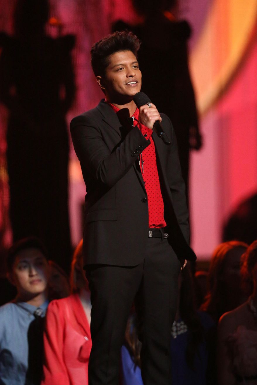 Bruno Mars speaks on stage at the 56th annual Grammy Awards at Staples Center on Sunday, Jan. 26, 2014, in Los Angeles. (Photo by Matt Sayles/Invision/AP)